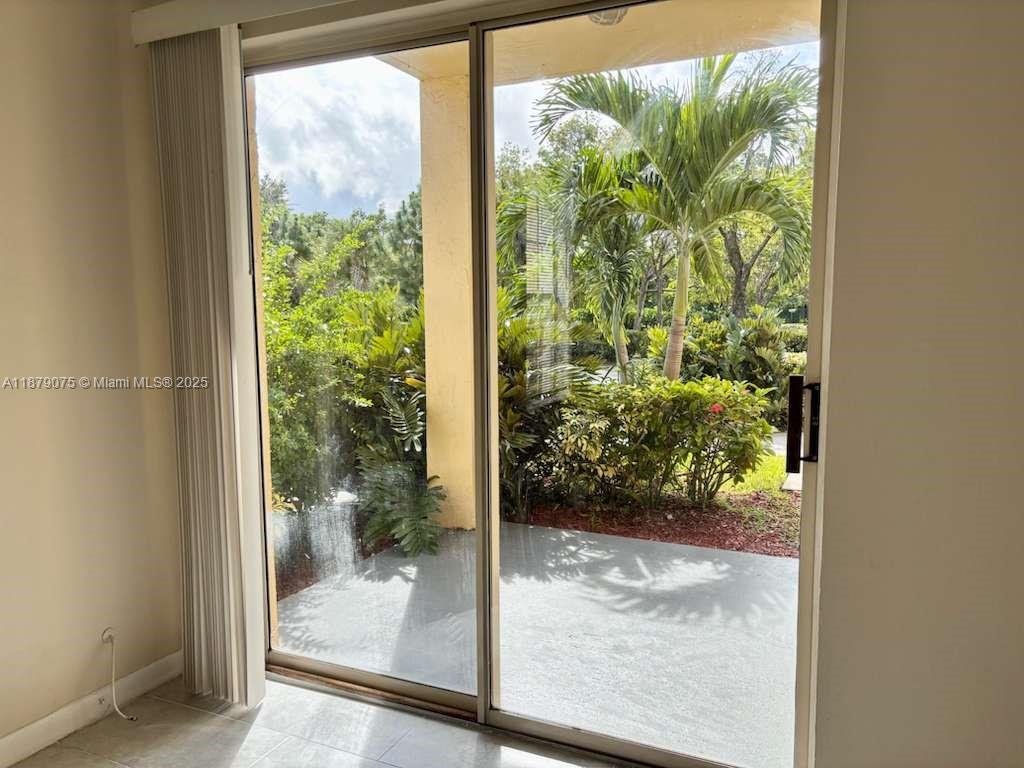 6340 La Costa Drive, Unit B Boca Raton, FL 33433 - Photo 7 of 16 a view of a glass door and porch