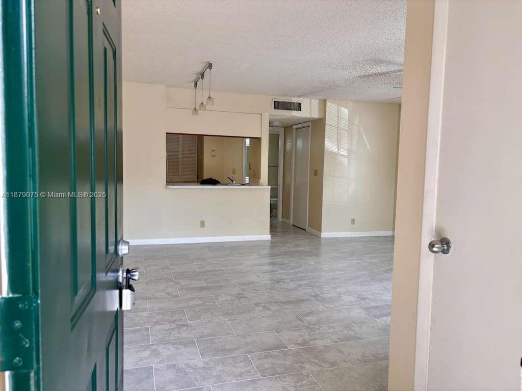 6340 La Costa Drive, Unit B Boca Raton, FL 33433 - Photo 9 of 16 a view of a livingroom with a flat screen tv