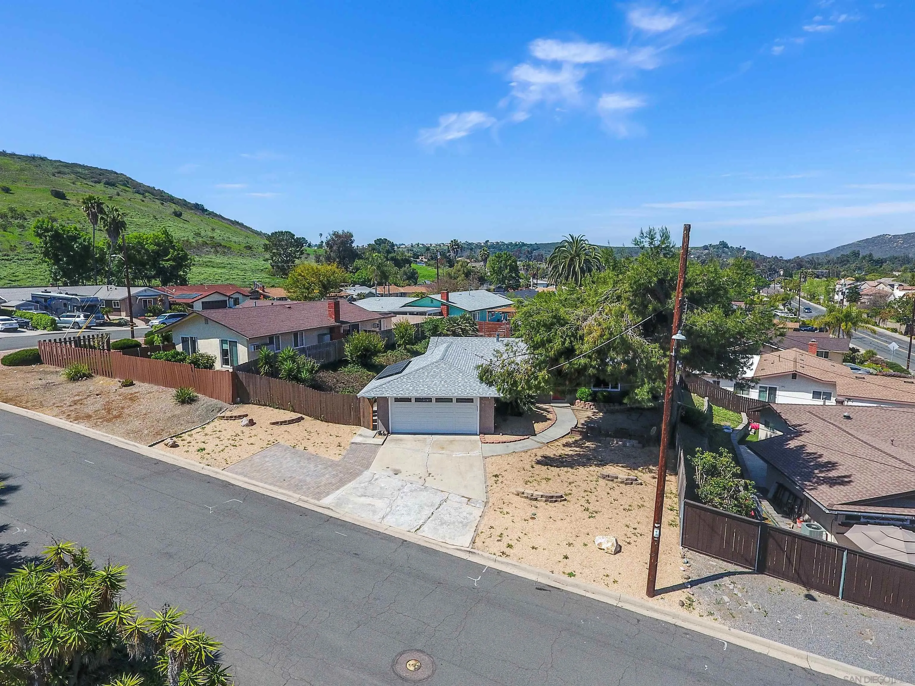 12710 Montauk Street Poway, CA 92064 - Photo 11 of 51 a view of a terrace with a garden and bench