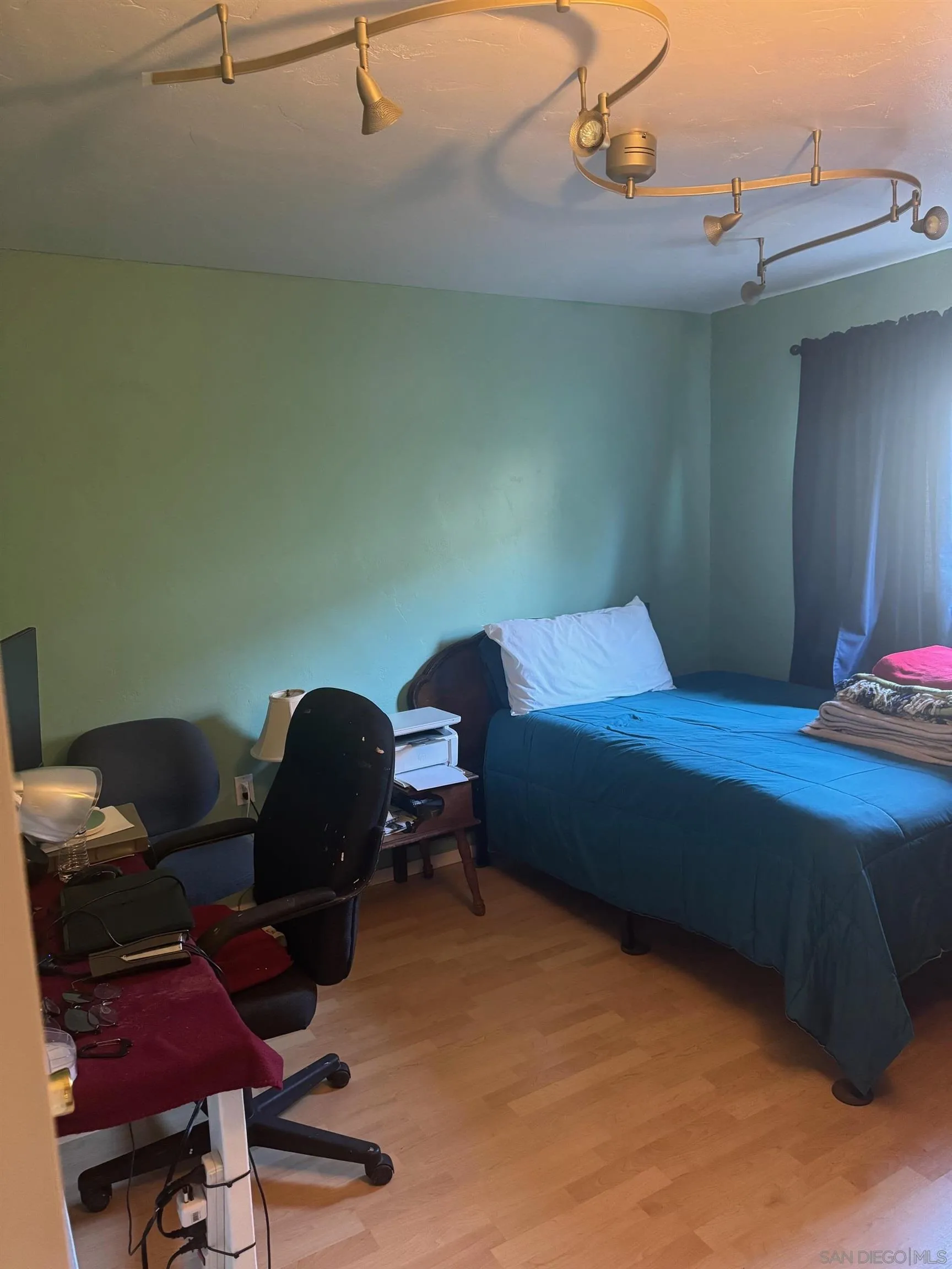 12710 Montauk Street Poway, CA 92064 - Photo 38 of 51 a bedroom with a bed and a chair