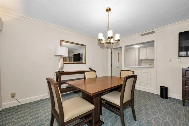 a living room with furniture and a glass door shower