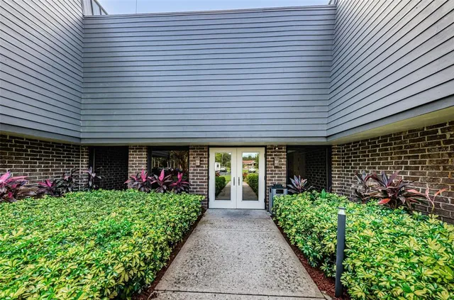 a bedroom with furniture and a flat screen tv
