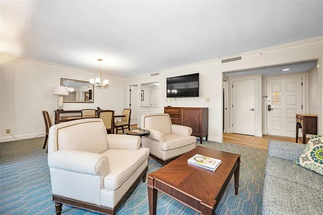 a kitchen with kitchen island a sink stainless steel appliances and cabinets