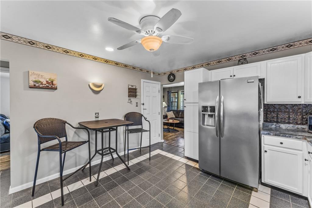 3370 Mercer Road New Castle, PA 16105 - Photo 8 of 25 a kitchen with stainless steel appliances granite countertop a refrigerator a stove a sink and island