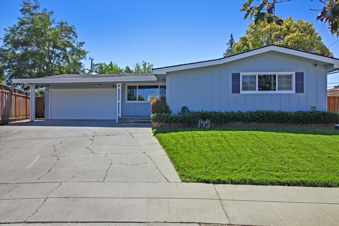 1693 Beck Drive San Jose, CA 95130 - Photo 1 of 37 a front view of a house with a garden