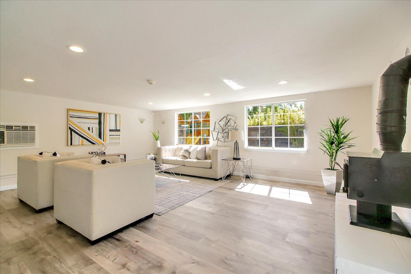 1693 Beck Drive San Jose, CA 95130 - Photo 13 of 37 a living room with furniture and a large window