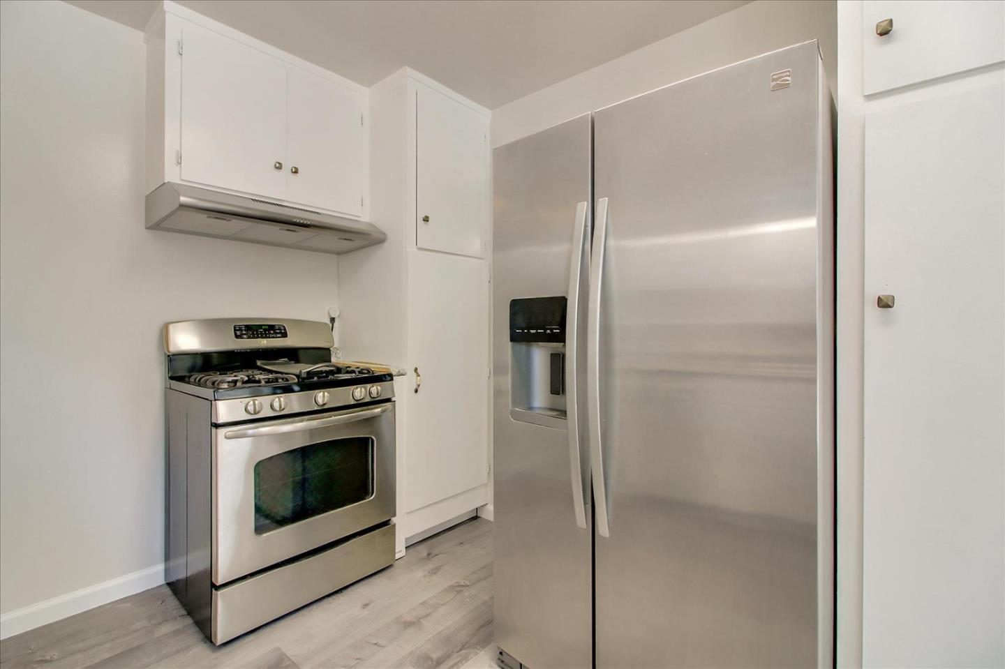 1693 Beck Drive San Jose, CA 95130 - Photo 17 of 37 a kitchen with cabinets and stainless steel appliances