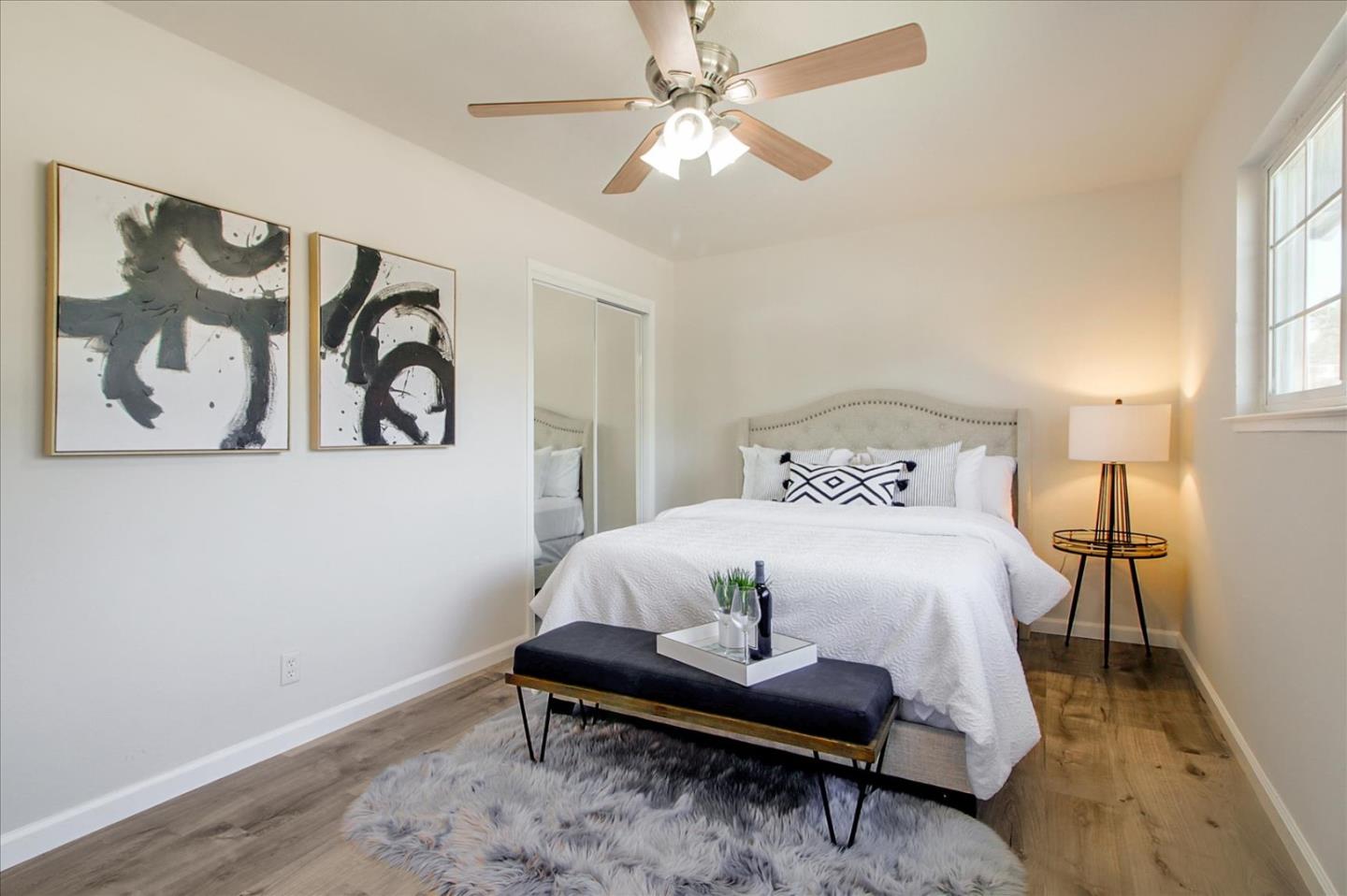 1693 Beck Drive San Jose, CA 95130 - Photo 19 of 37 a bedroom with a bed and a table