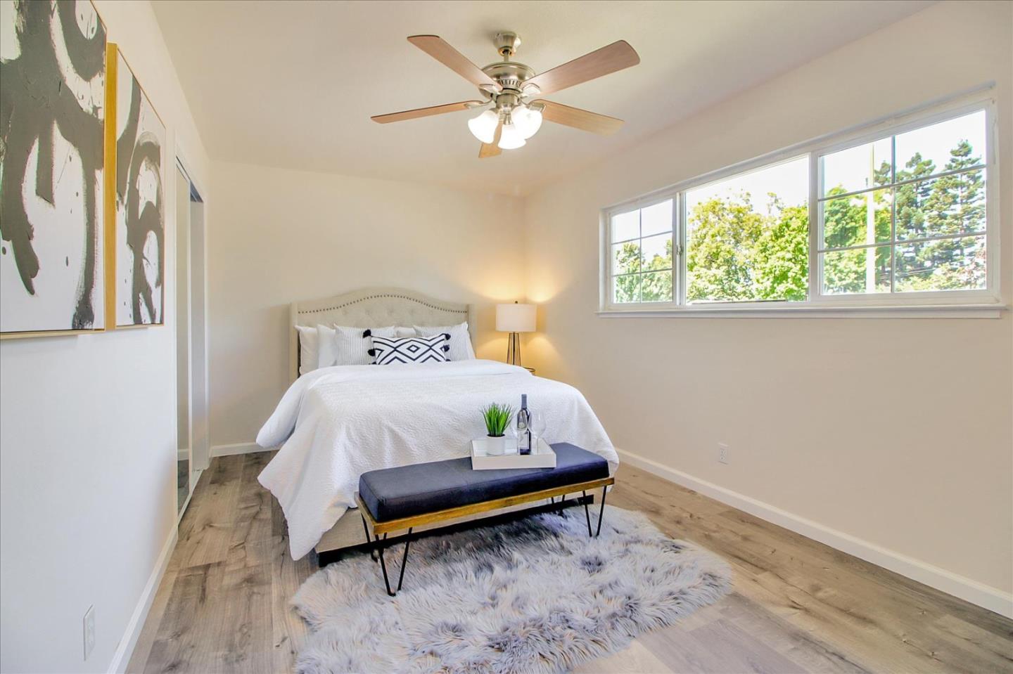 1693 Beck Drive San Jose, CA 95130 - Photo 20 of 37 a bed sitting in a bedroom next to a window