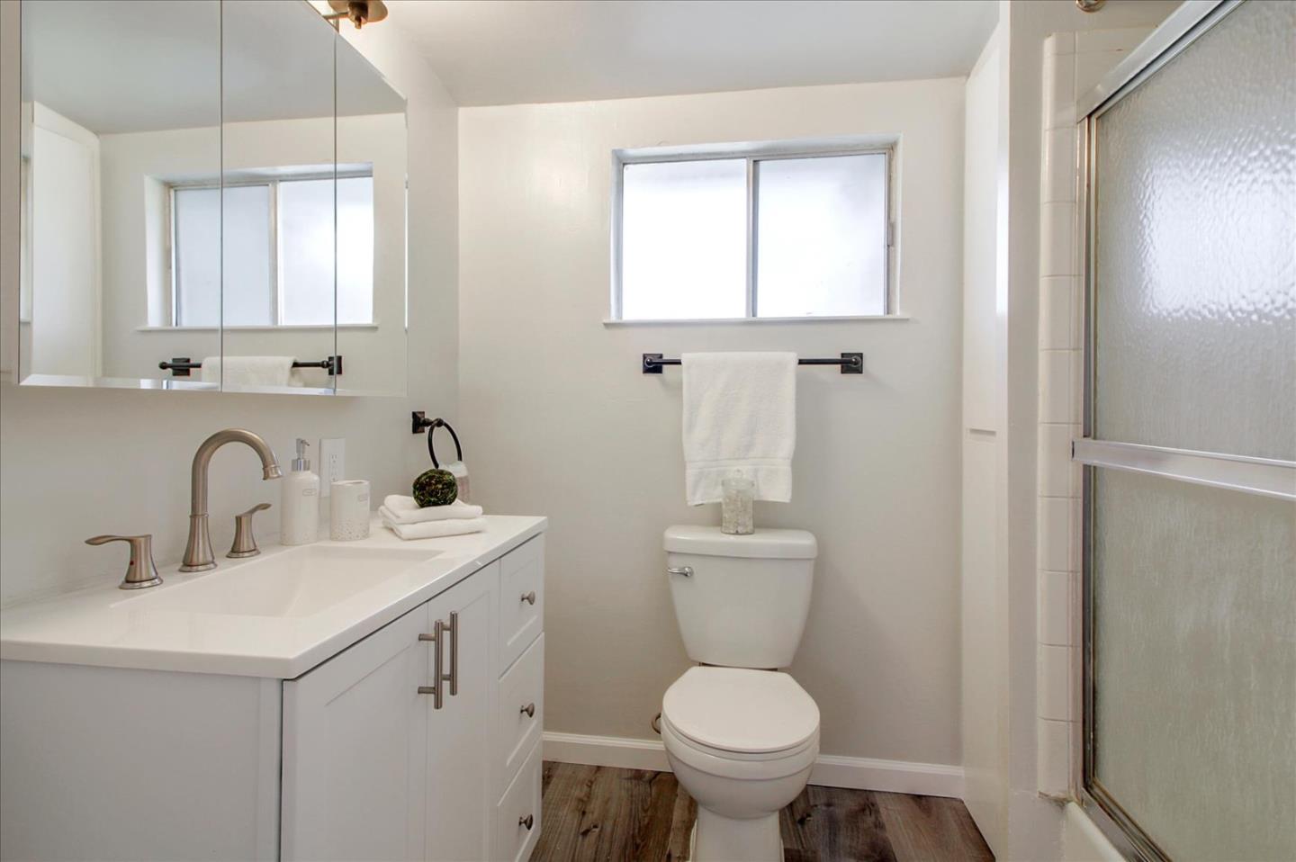 1693 Beck Drive San Jose, CA 95130 - Photo 22 of 37 a bathroom with a toilet sink and mirror
