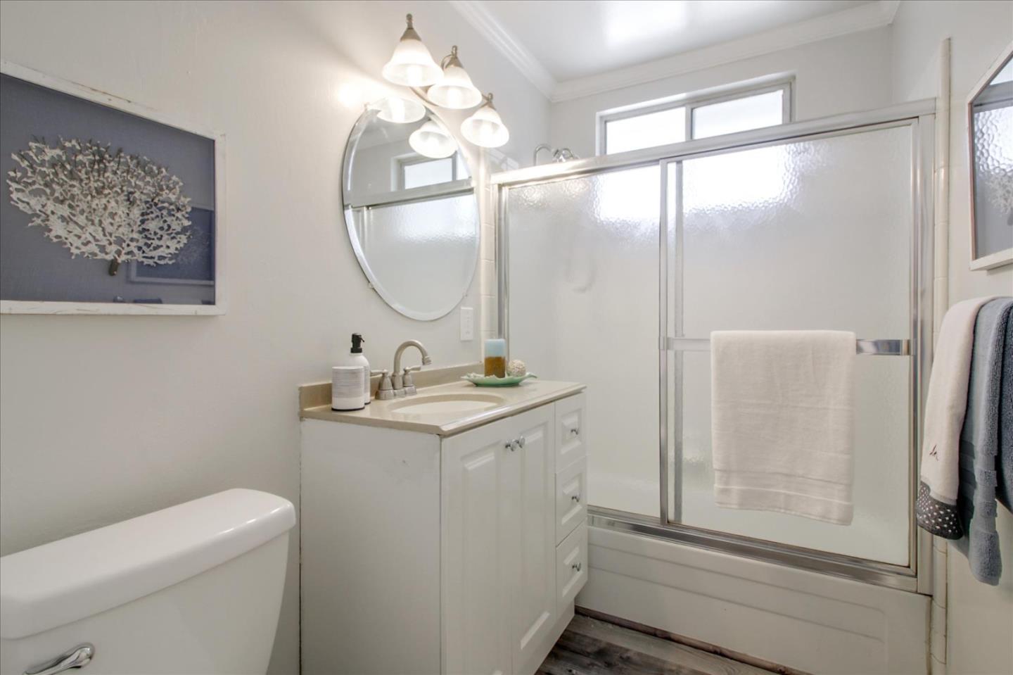 1693 Beck Drive San Jose, CA 95130 - Photo 25 of 37 a bathroom with a granite countertop sink a toilet and a mirror
