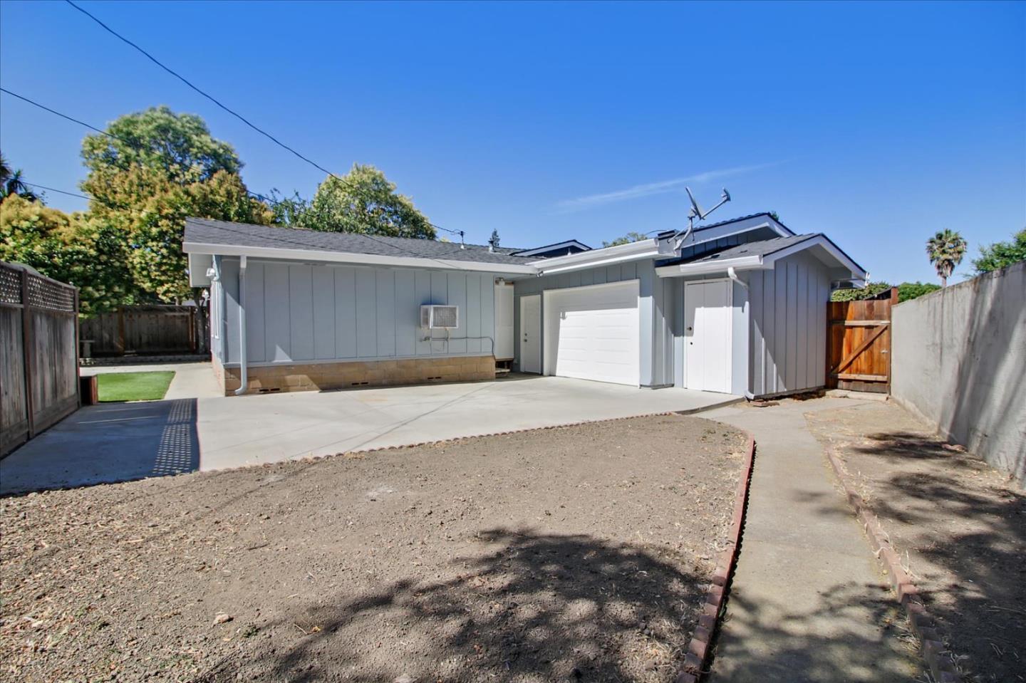 1693 Beck Drive San Jose, CA 95130 - Photo 28 of 37 a front view of a house with a yard and garage