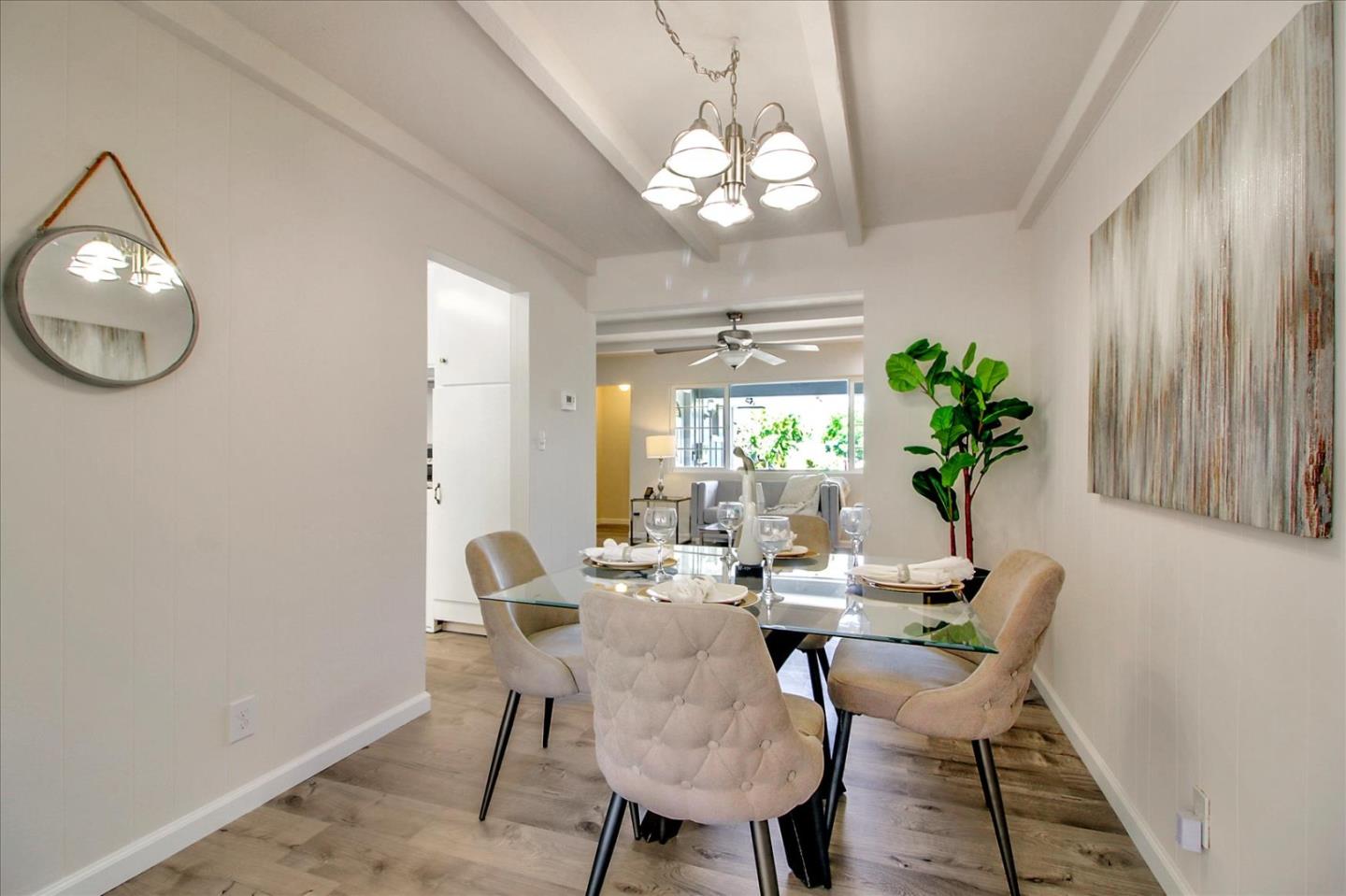 1693 Beck Drive San Jose, CA 95130 - Photo 10 of 37 a view of a dining room with furniture and a chandelier