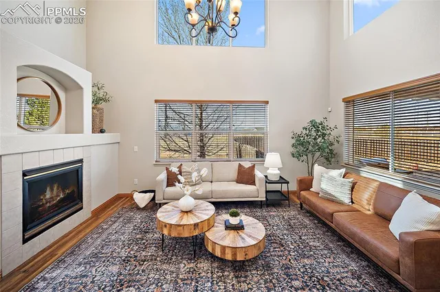 a living room with furniture and a fireplace