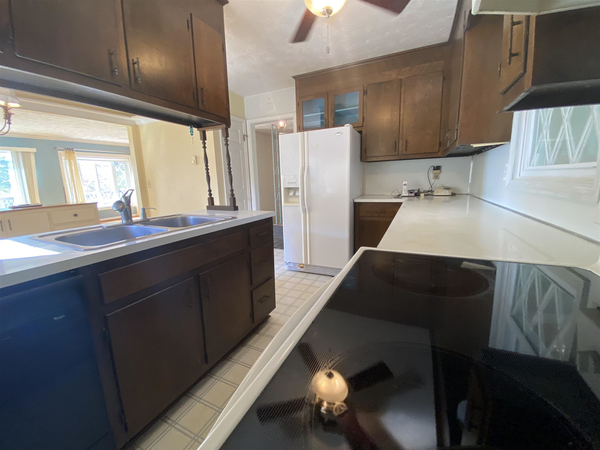1773 Roman Road Mount Sidney, VA 24467 - Photo 23 of 45 a kitchen with a sink a refrigerator and cabinets