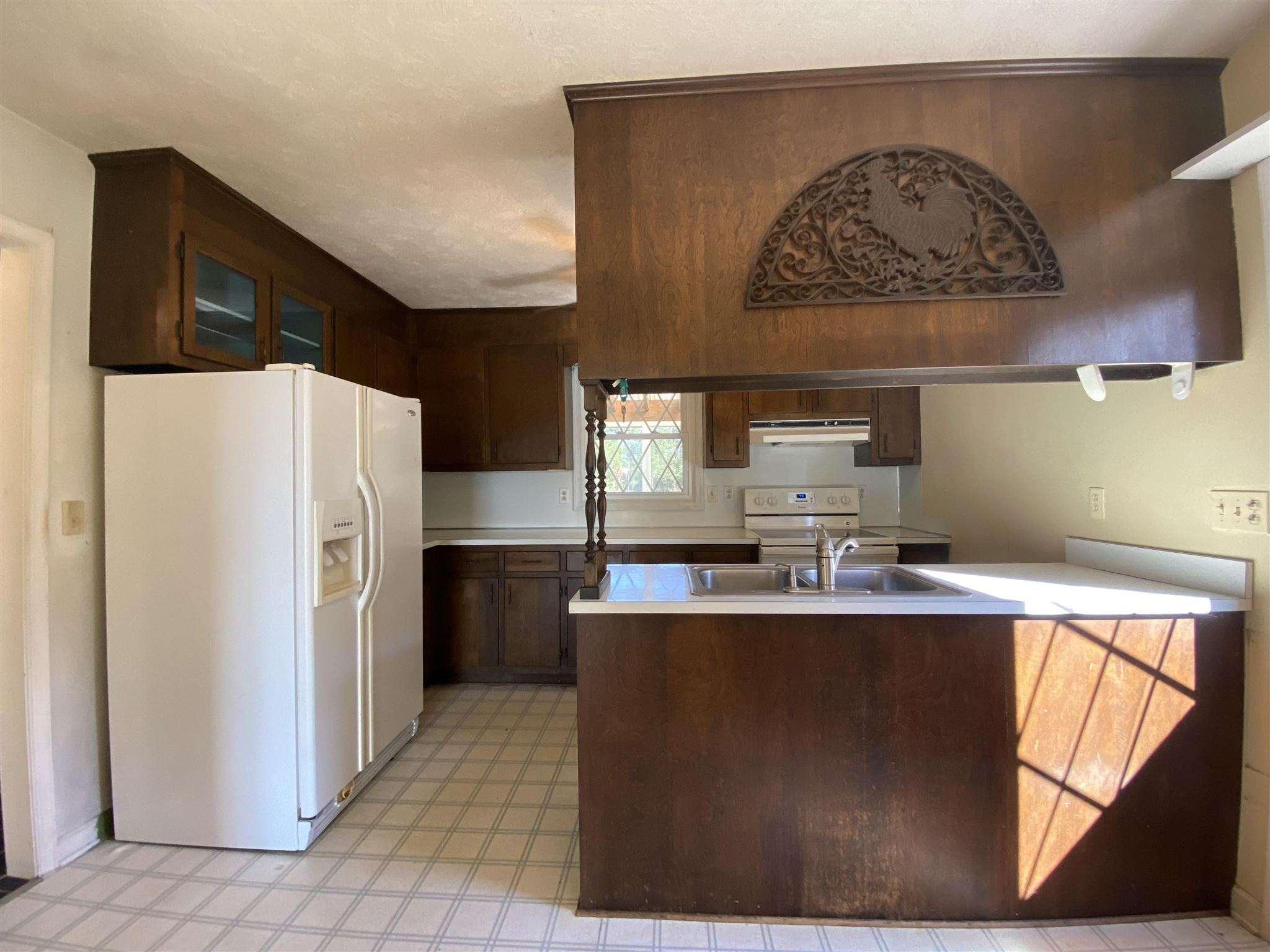 1773 Roman Road Mount Sidney, VA 24467 - Photo 24 of 45 a kitchen with kitchen island granite countertop a refrigerator a sink a stove and wooden cabinets