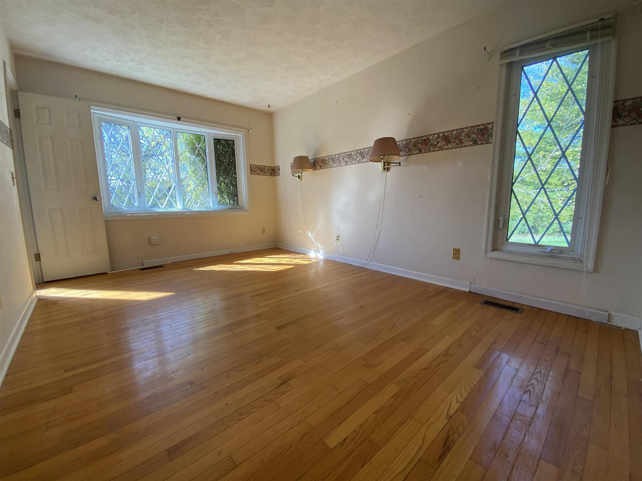 1773 Roman Road Mount Sidney, VA 24467 - Photo 28 of 45 a view of an empty room with wooden floor and a window
