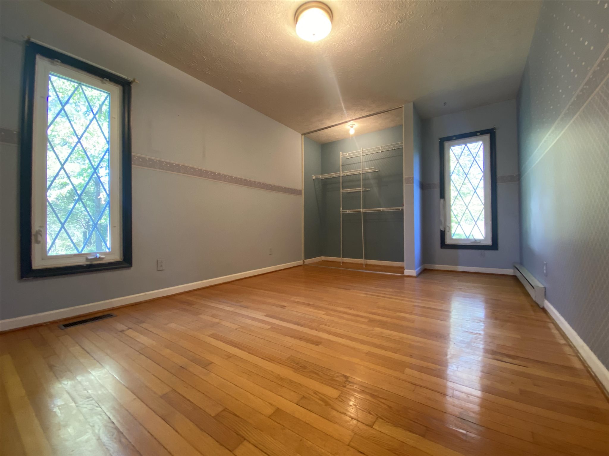 1773 Roman Road Mount Sidney, VA 24467 - Photo 31 of 45 an empty room with wooden floor and windows