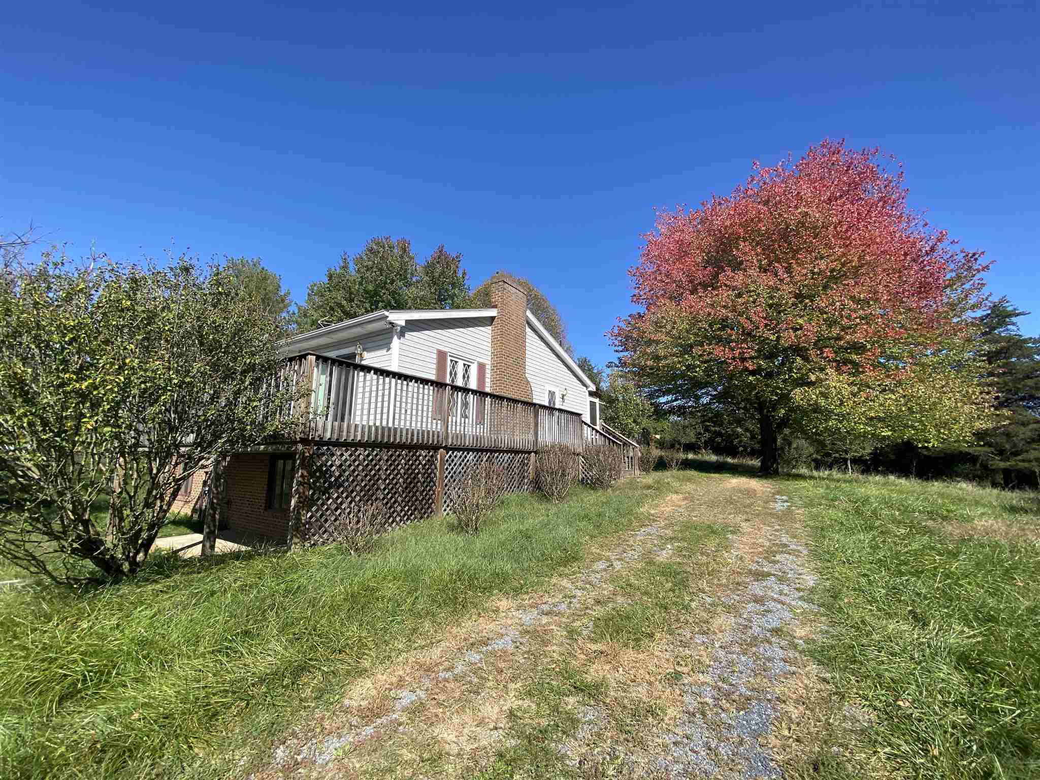 1773 Roman Road Mount Sidney, VA 24467 - Photo 6 of 45 a front view of a house with a yard