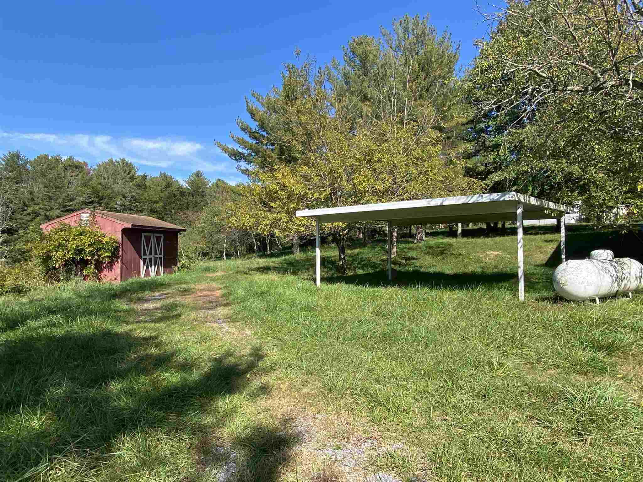 1773 Roman Road Mount Sidney, VA 24467 - Photo 9 of 45 a view of a wooden deck and a yard