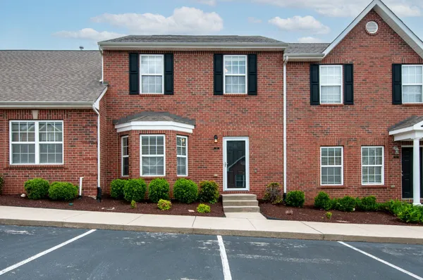 a front view of a house having yard