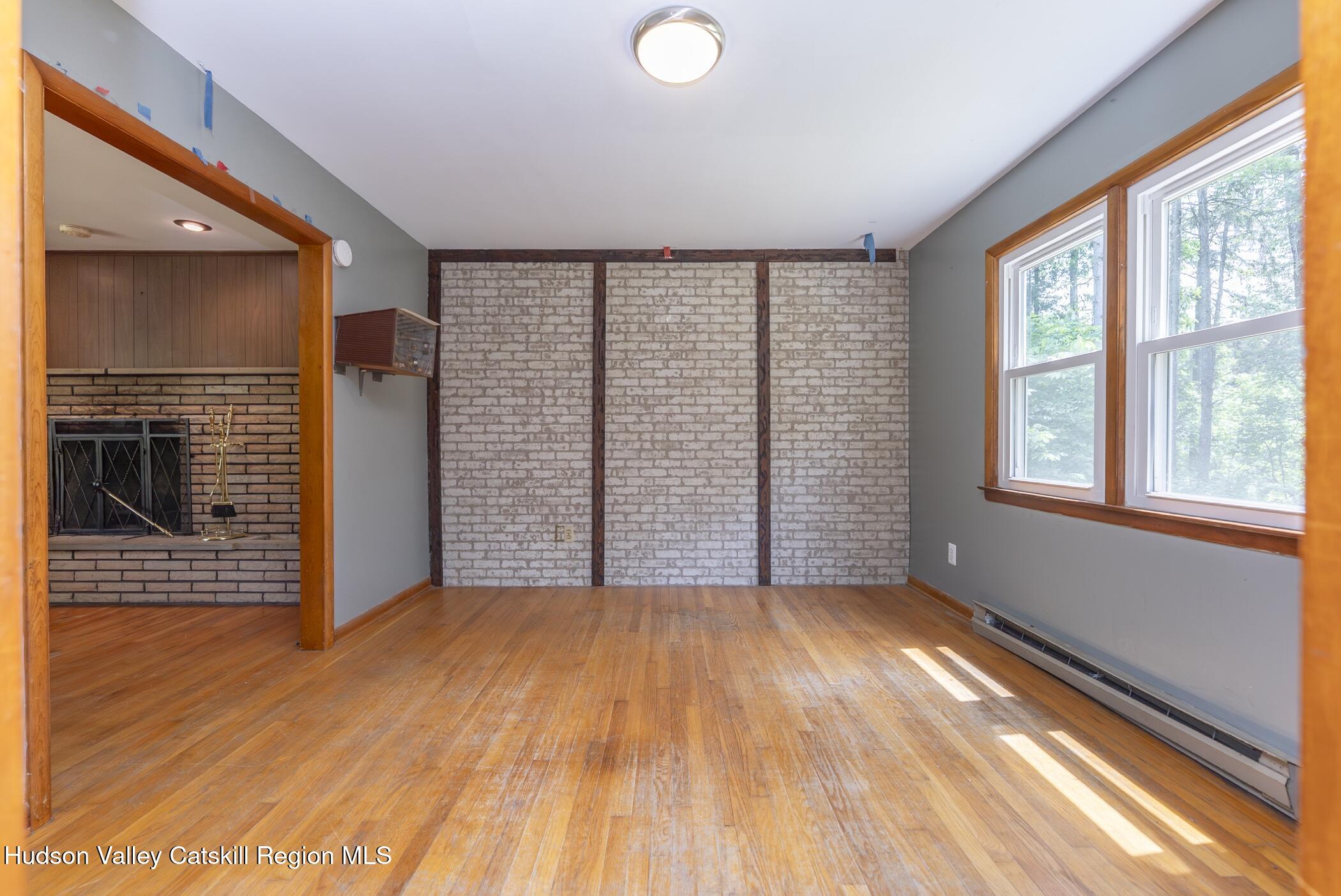 22 Robert Drive Hyde Park, NY 12538 - Photo 18 of 52 a view of empty room with wooden floor and fan