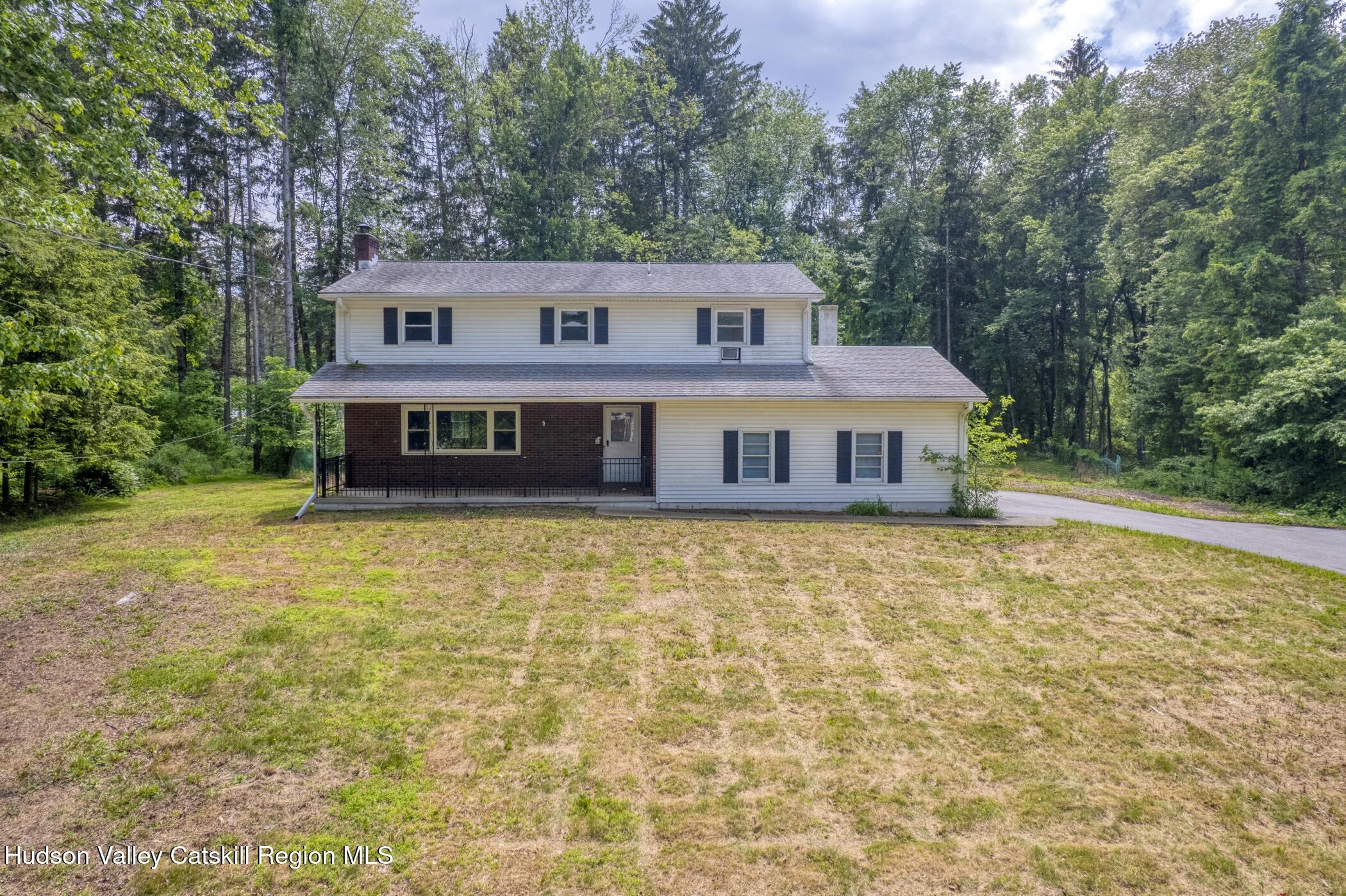 22 Robert Drive Hyde Park, NY 12538 - Photo 2 of 52 a front view of a house with a yard