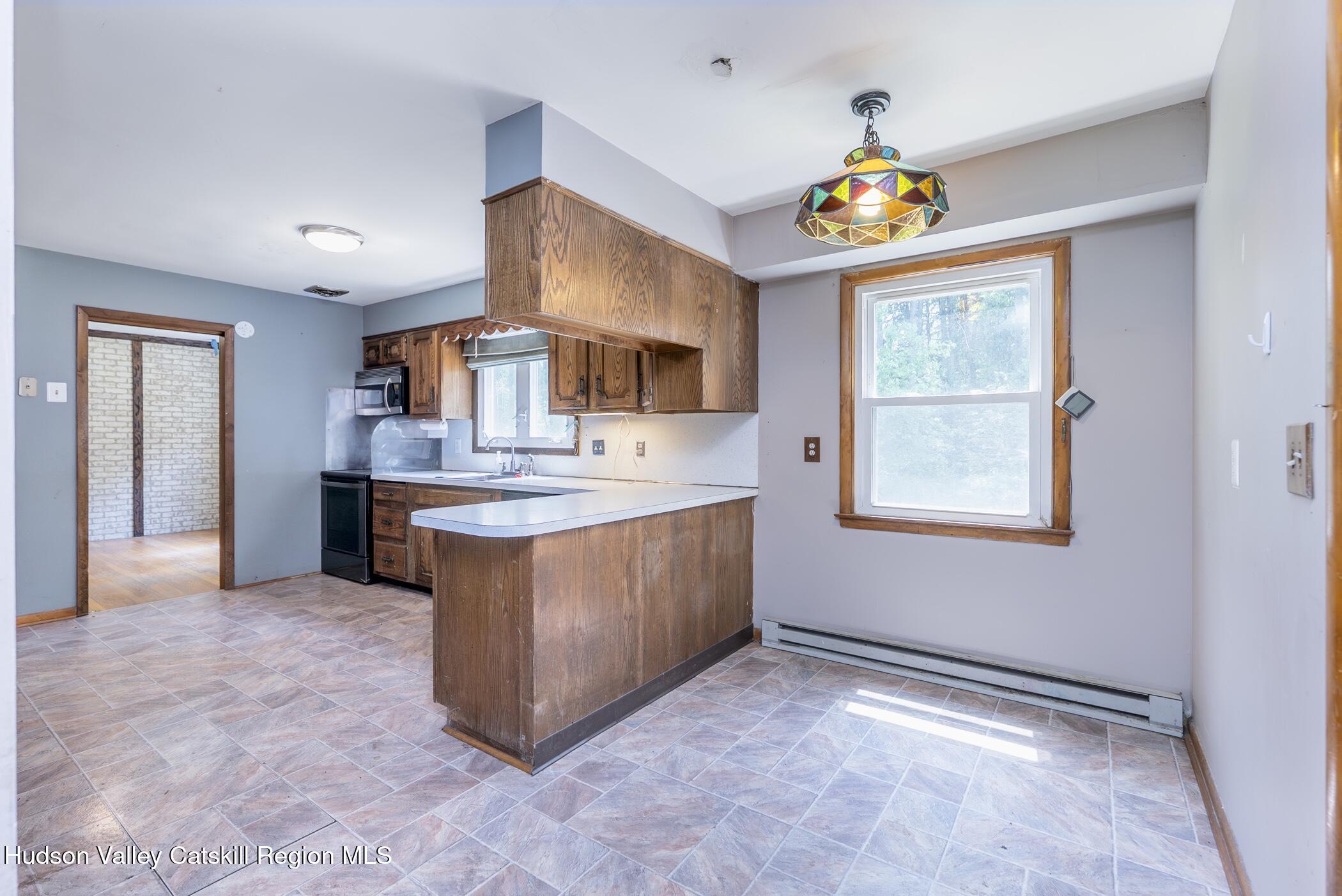 22 Robert Drive Hyde Park, NY 12538 - Photo 21 of 52 a kitchen with stainless steel appliances granite countertop a sink and a stove