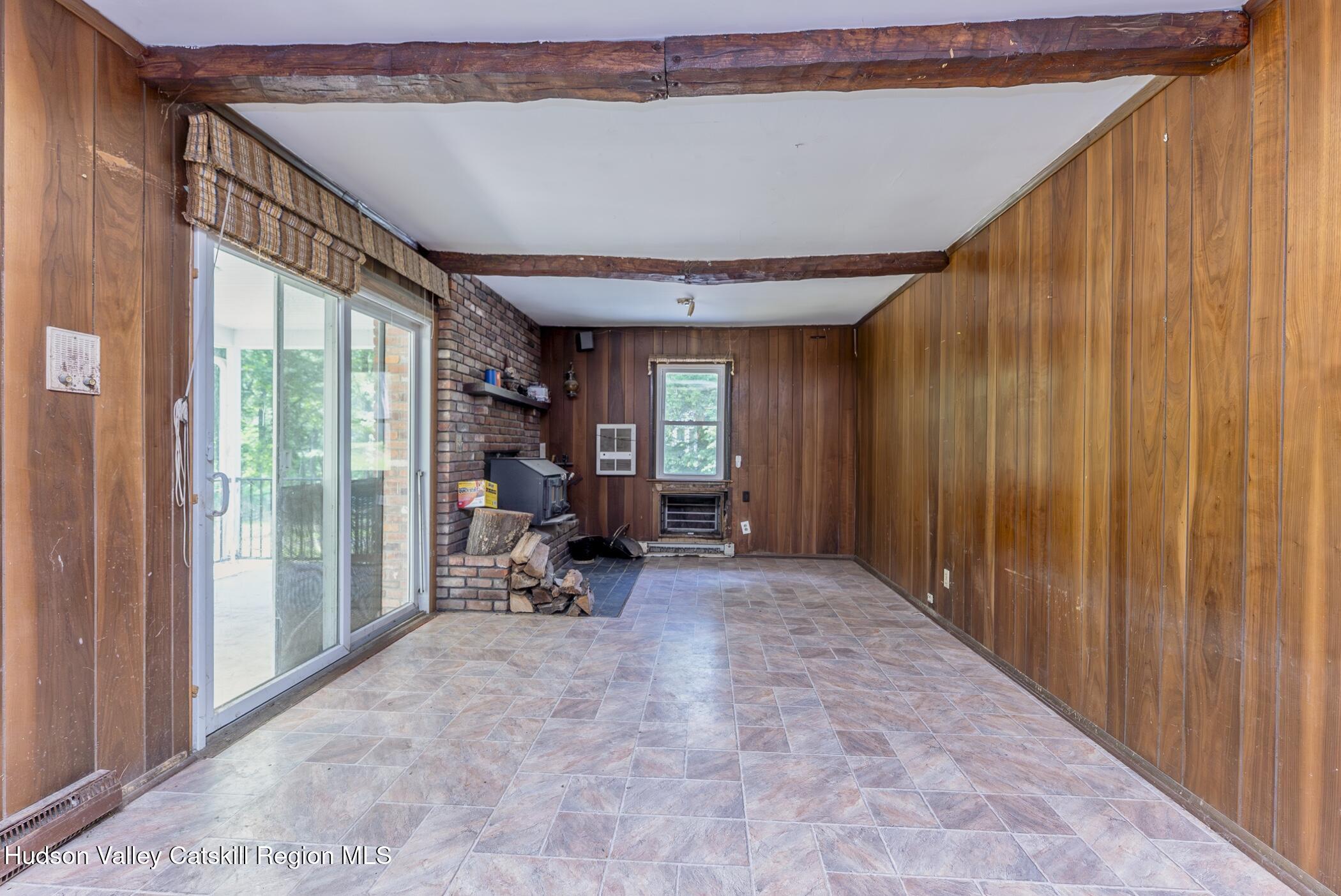 22 Robert Drive Hyde Park, NY 12538 - Photo 22 of 52 a view of a hallway with a chair and dining table view