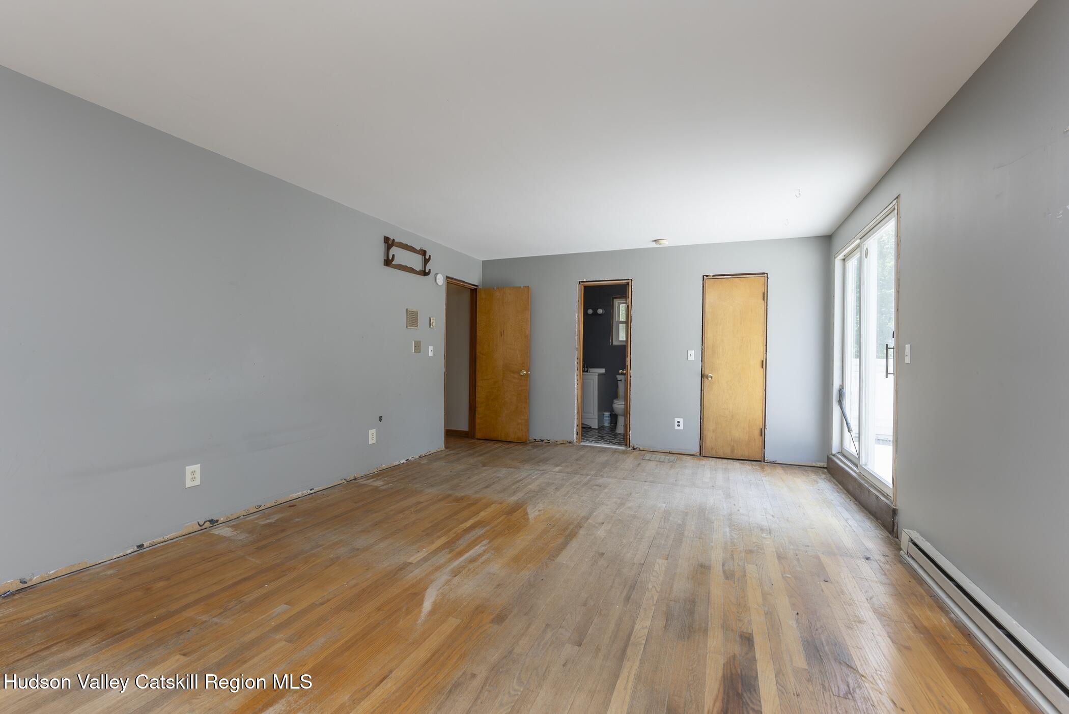 22 Robert Drive Hyde Park, NY 12538 - Photo 29 of 52 a view of an empty room with window and wooden floor