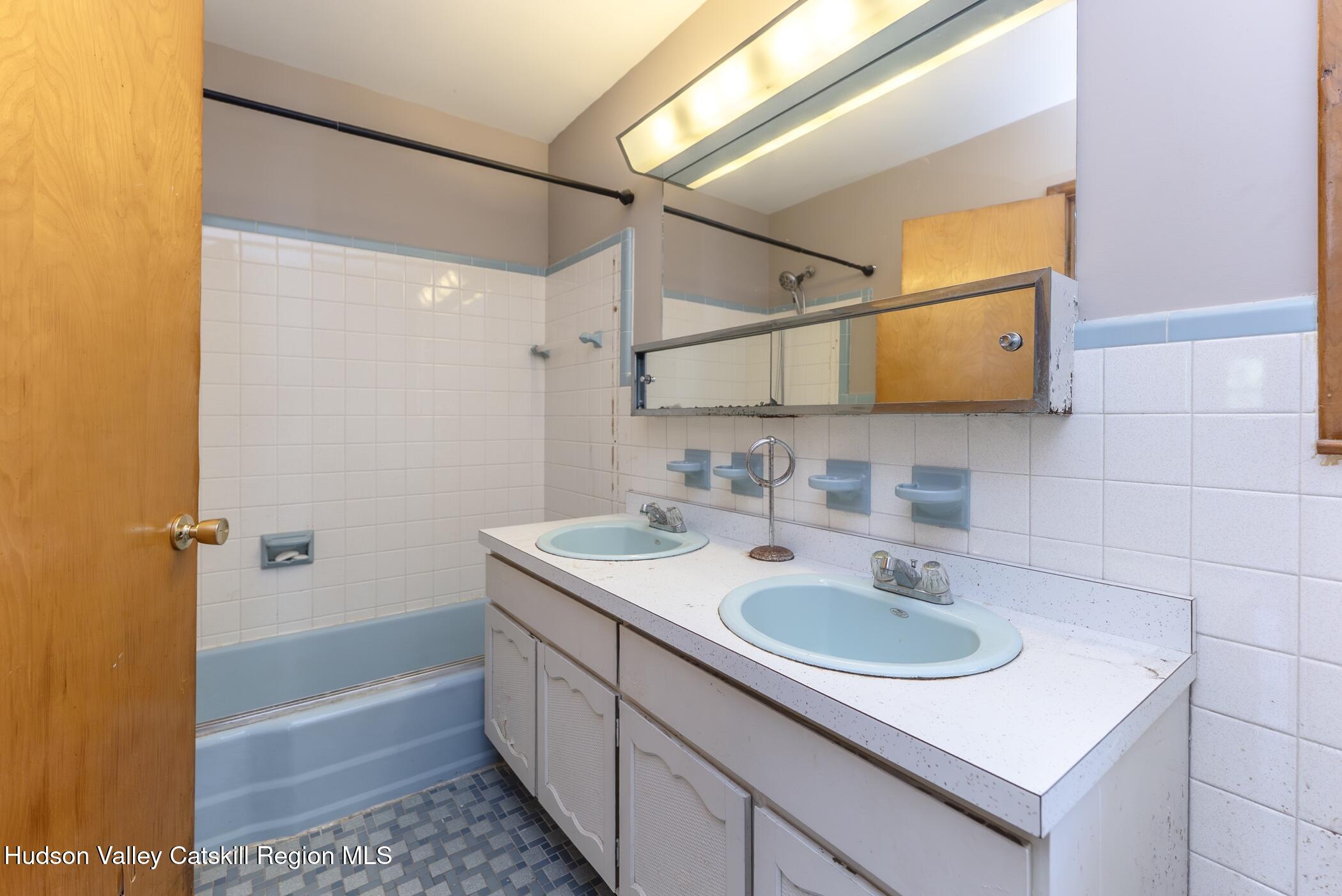 22 Robert Drive Hyde Park, NY 12538 - Photo 34 of 52 a bathroom with a sink and a mirror