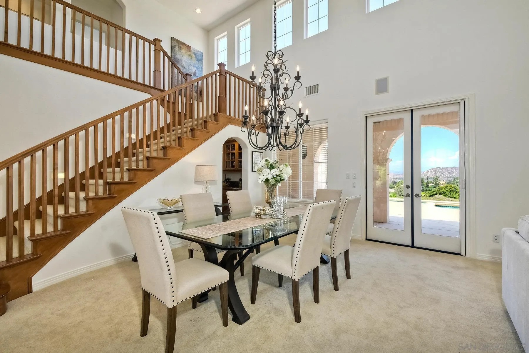 13660 Overland Pass Road Poway, CA 92064 - Photo 11 of 61 a view of a dining room with furniture and a chandelier