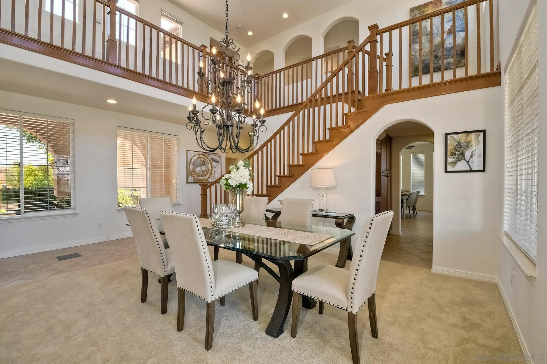 13660 Overland Pass Road Poway, CA 92064 - Photo 13 of 61 a view of a dining room with furniture and chandelier