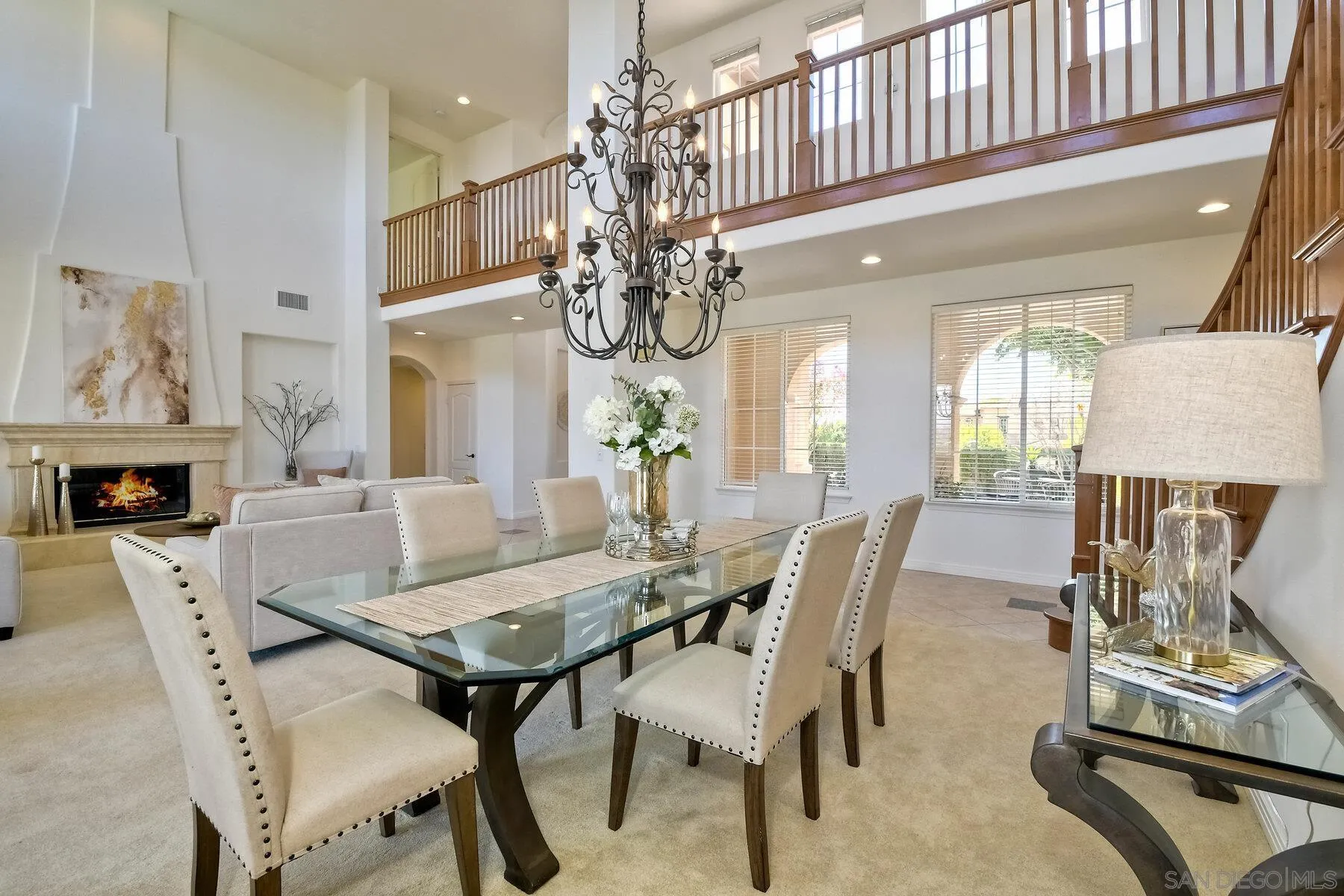 13660 Overland Pass Road Poway, CA 92064 - Photo 14 of 61 a view of a dining room with furniture and a chandelier