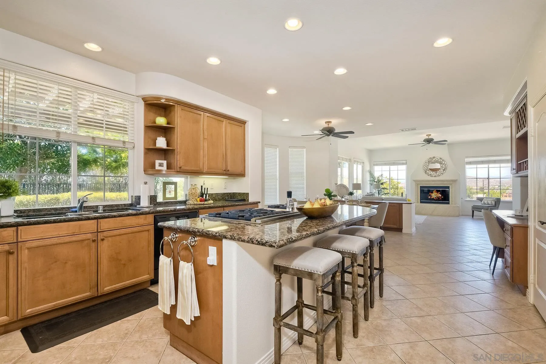 13660 Overland Pass Road Poway, CA 92064 - Photo 19 of 61 a kitchen with lots of counter top space and furniture