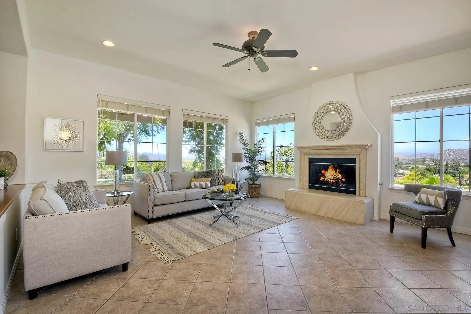 13660 Overland Pass Road Poway, CA 92064 - Photo 23 of 61 a living room with furniture and a fireplace