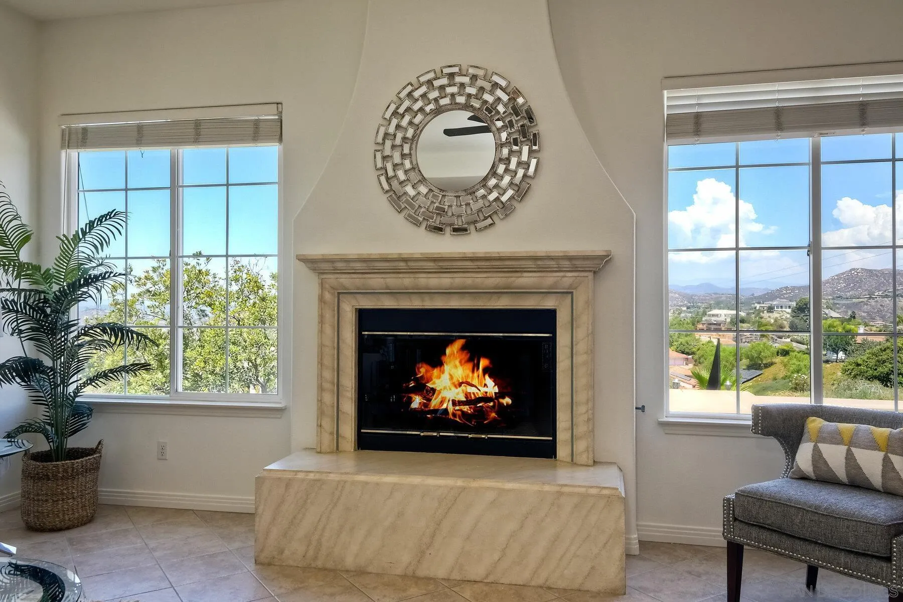 13660 Overland Pass Road Poway, CA 92064 - Photo 26 of 61 a living room with furniture a fireplace and a potted plant