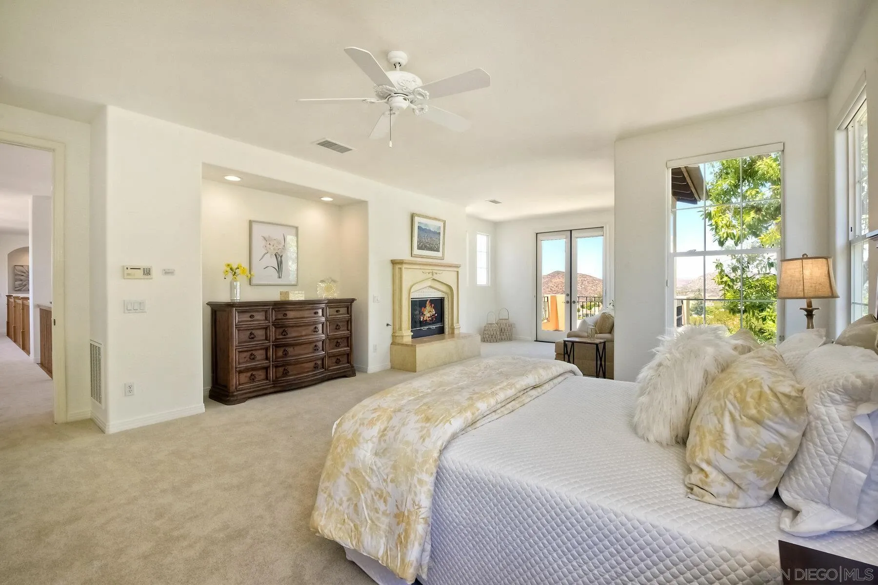 13660 Overland Pass Road Poway, CA 92064 - Photo 29 of 61 a spacious bedroom with a bed and ceiling fan