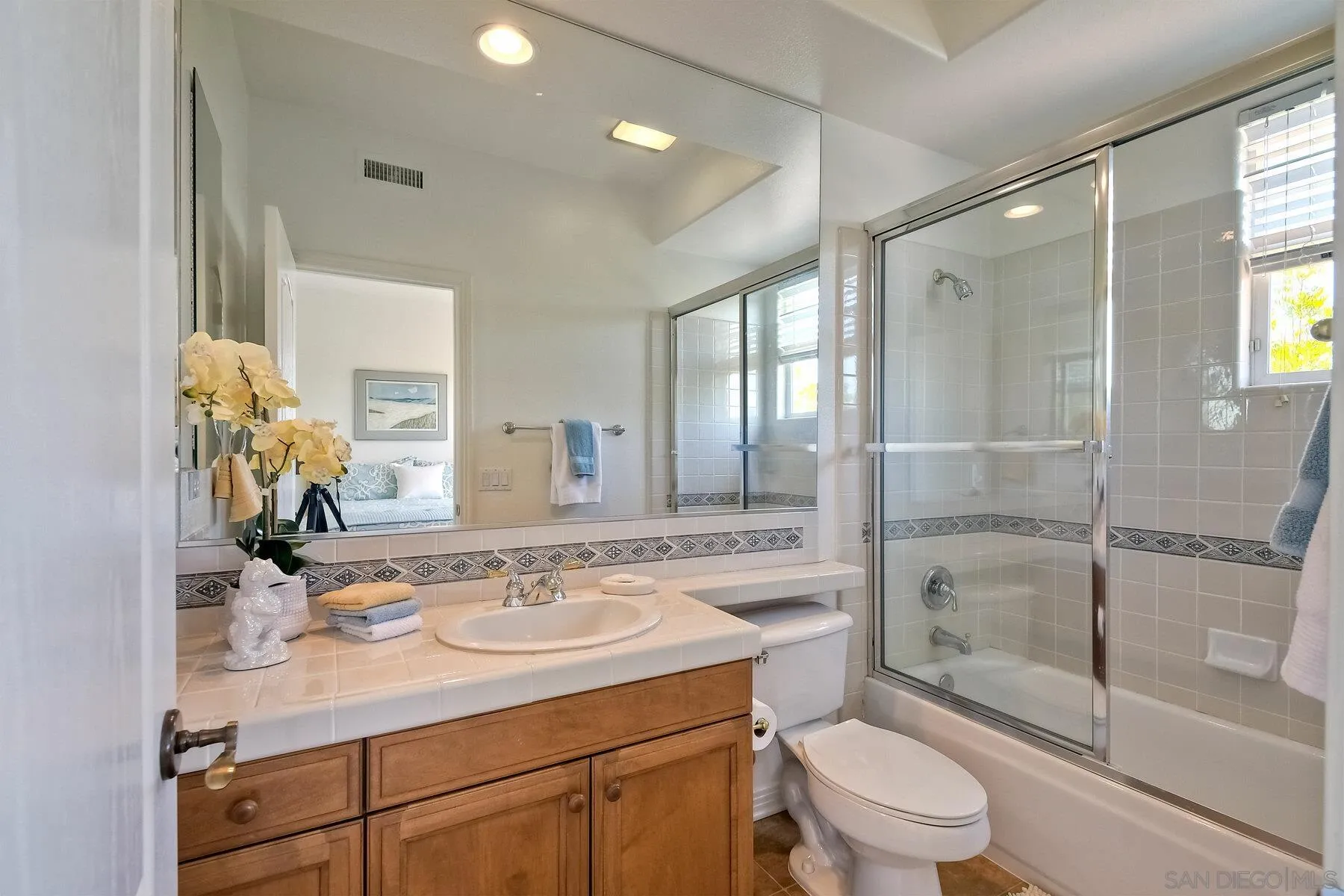 13660 Overland Pass Road Poway, CA 92064 - Photo 33 of 61 a bathroom with a sink toilet and shower