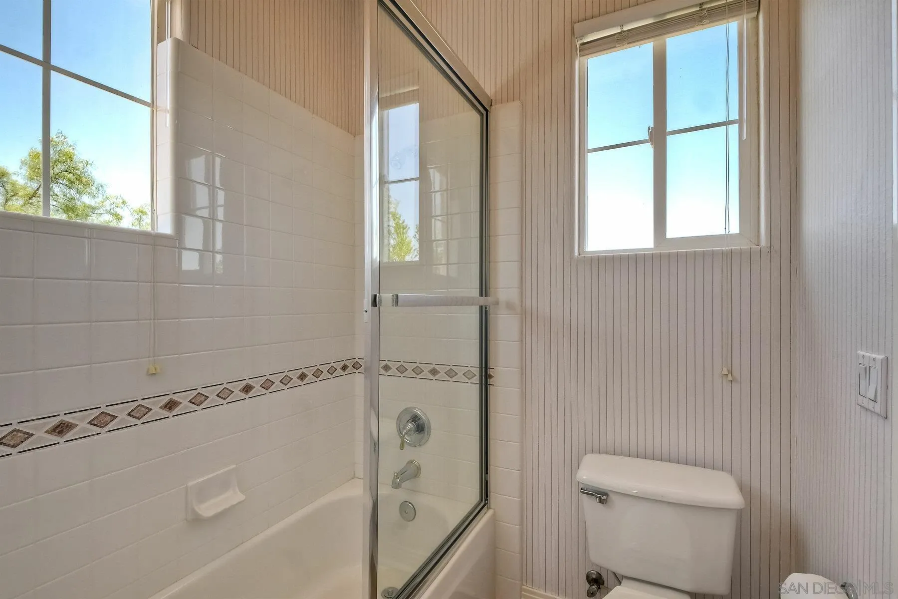 13660 Overland Pass Road Poway, CA 92064 - Photo 37 of 61 a bathroom with a granite countertop bathtub and a toilet