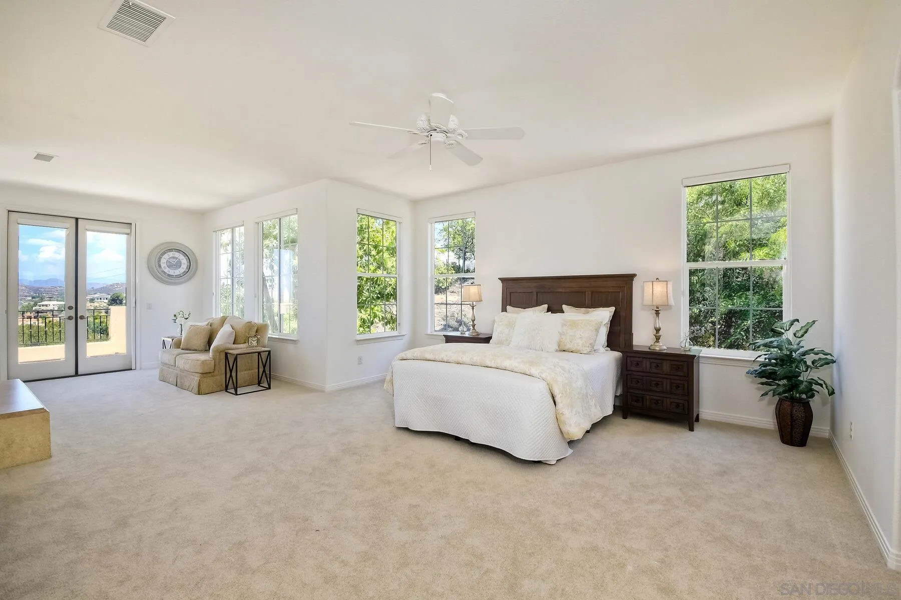 13660 Overland Pass Road Poway, CA 92064 - Photo 38 of 61 a bed room with furniture and a chandelier