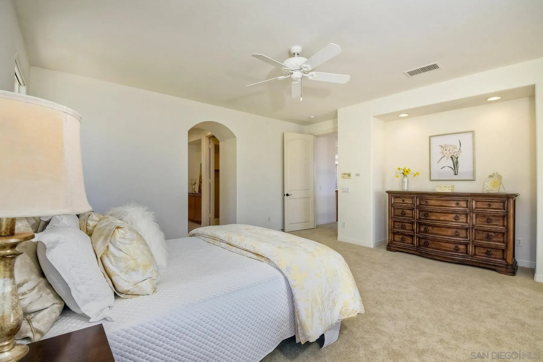 13660 Overland Pass Road Poway, CA 92064 - Photo 41 of 61 a bedroom with a bed and a chandelier