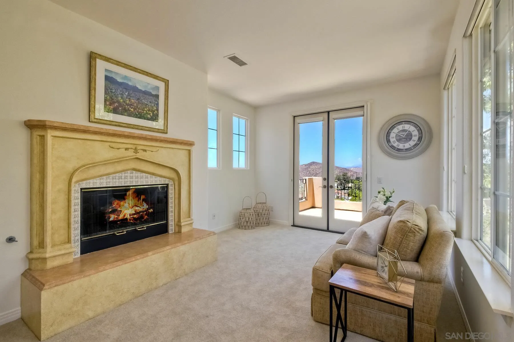 13660 Overland Pass Road Poway, CA 92064 - Photo 43 of 61 a living room with furniture and a fireplace