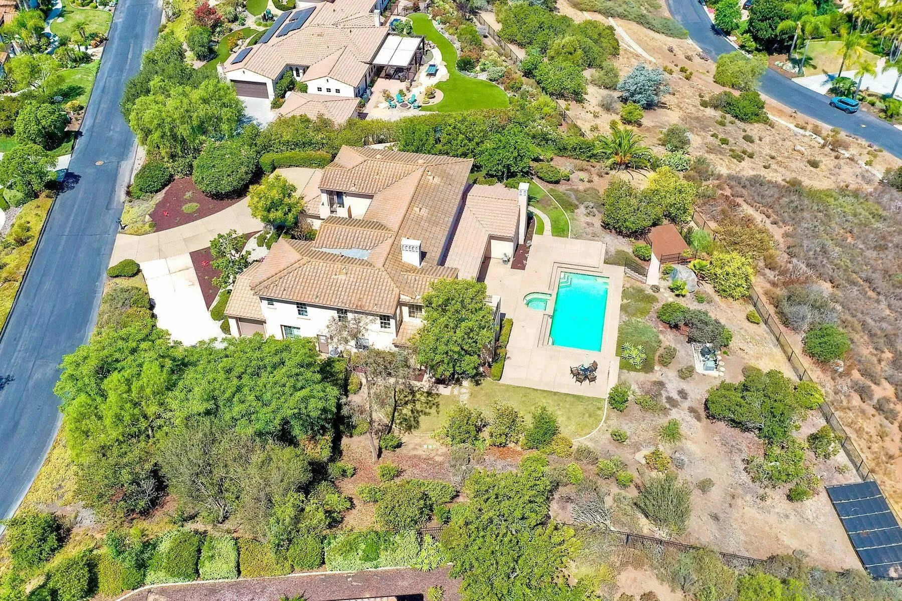 13660 Overland Pass Road Poway, CA 92064 - Photo 50 of 61 an aerial view of a house with a yard and garden