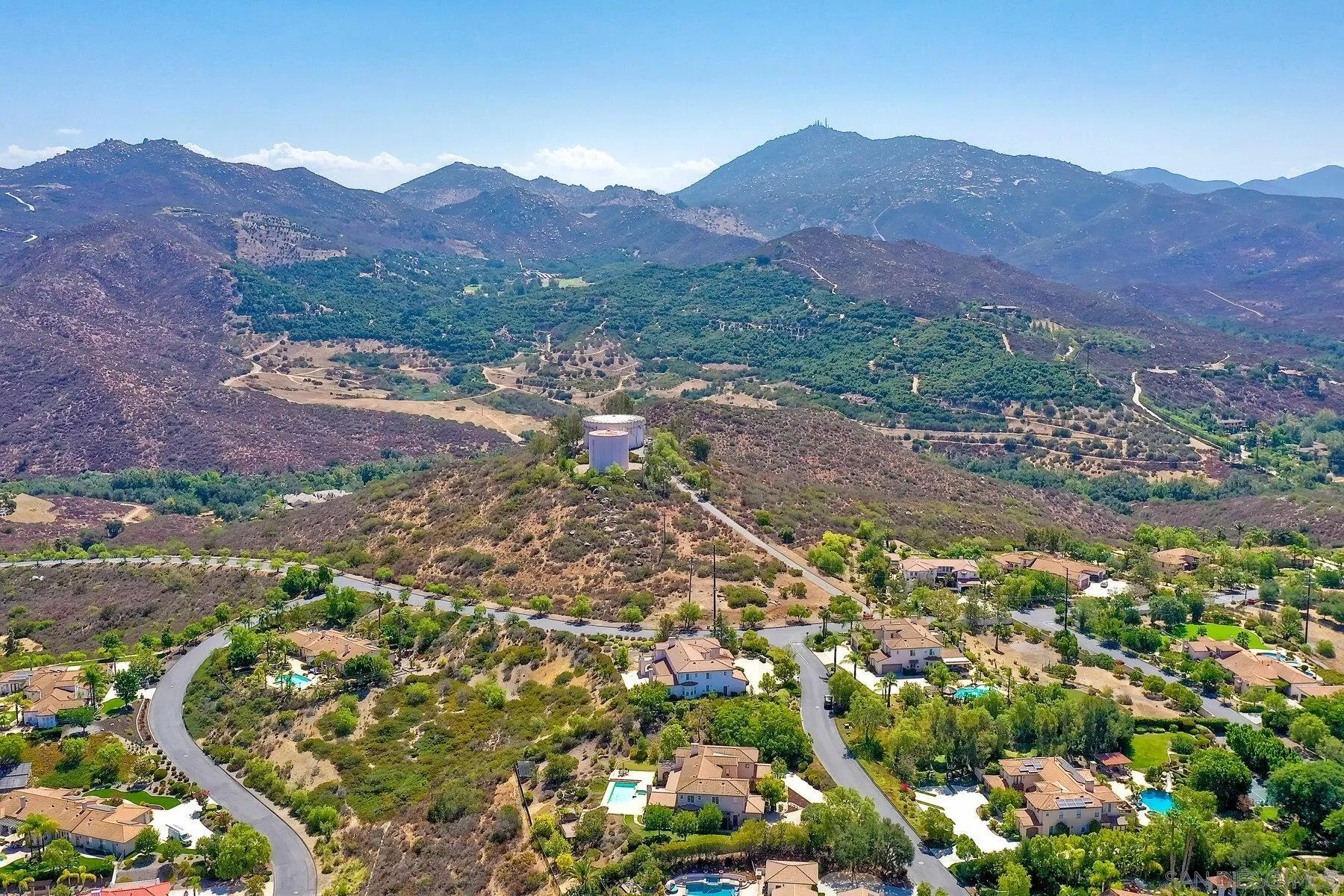 13660 Overland Pass Road Poway, CA 92064 - Photo 53 of 61 a view of a lush green hillside and houses