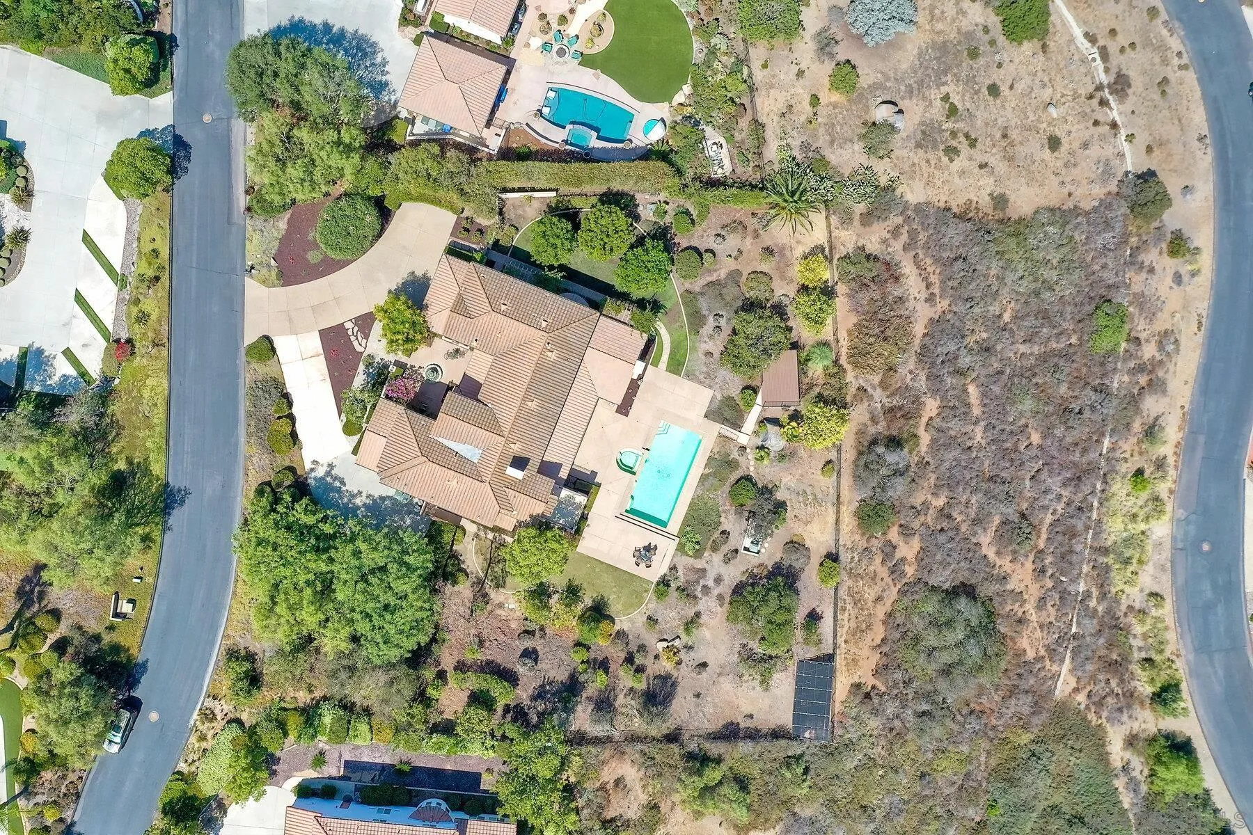 13660 Overland Pass Road Poway, CA 92064 - Photo 54 of 61 an aerial view of a house with a yard and large trees