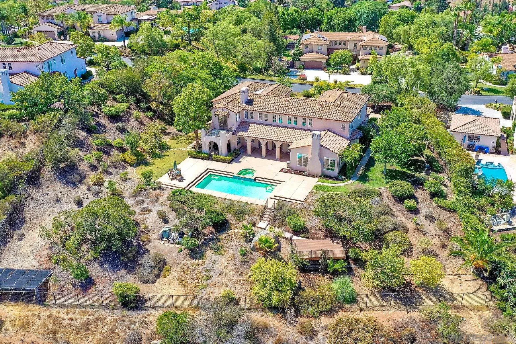 13660 Overland Pass Road Poway, CA 92064 - Photo 55 of 61 an aerial view of multiple houses with yard