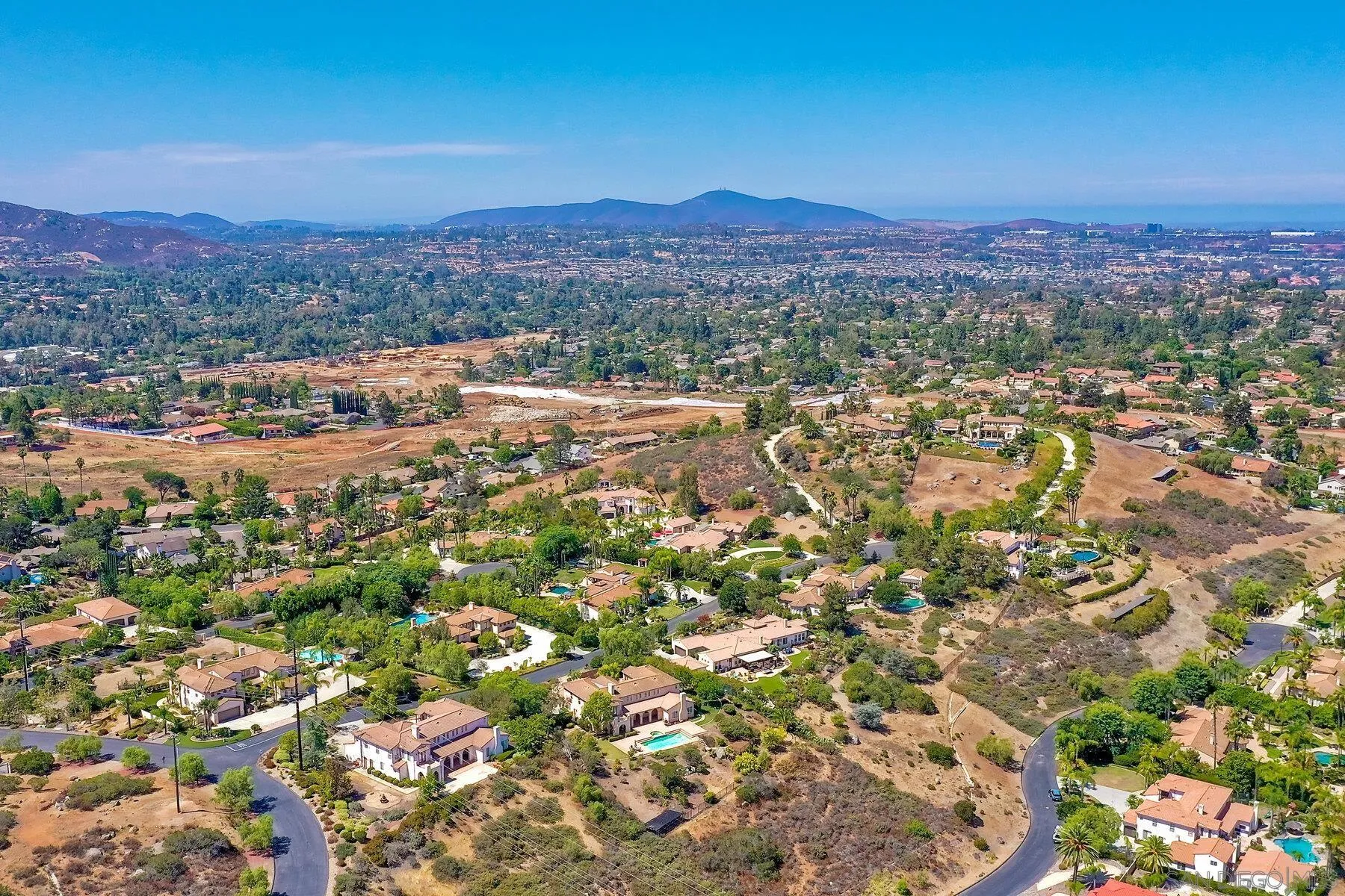 13660 Overland Pass Road Poway, CA 92064 - Photo 6 of 61 a view of a city with mountains in the background