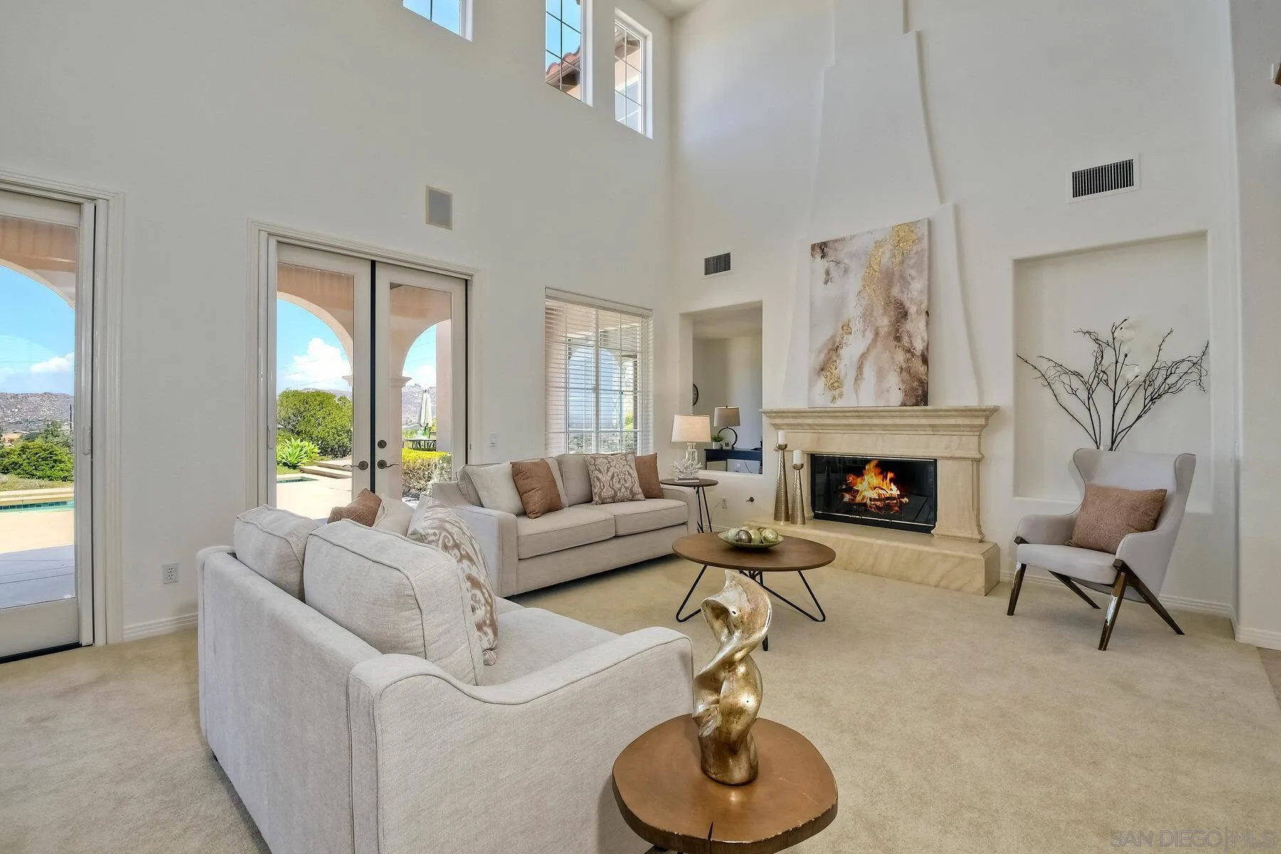 13660 Overland Pass Road Poway, CA 92064 - Photo 8 of 61 a living room with furniture and a fireplace