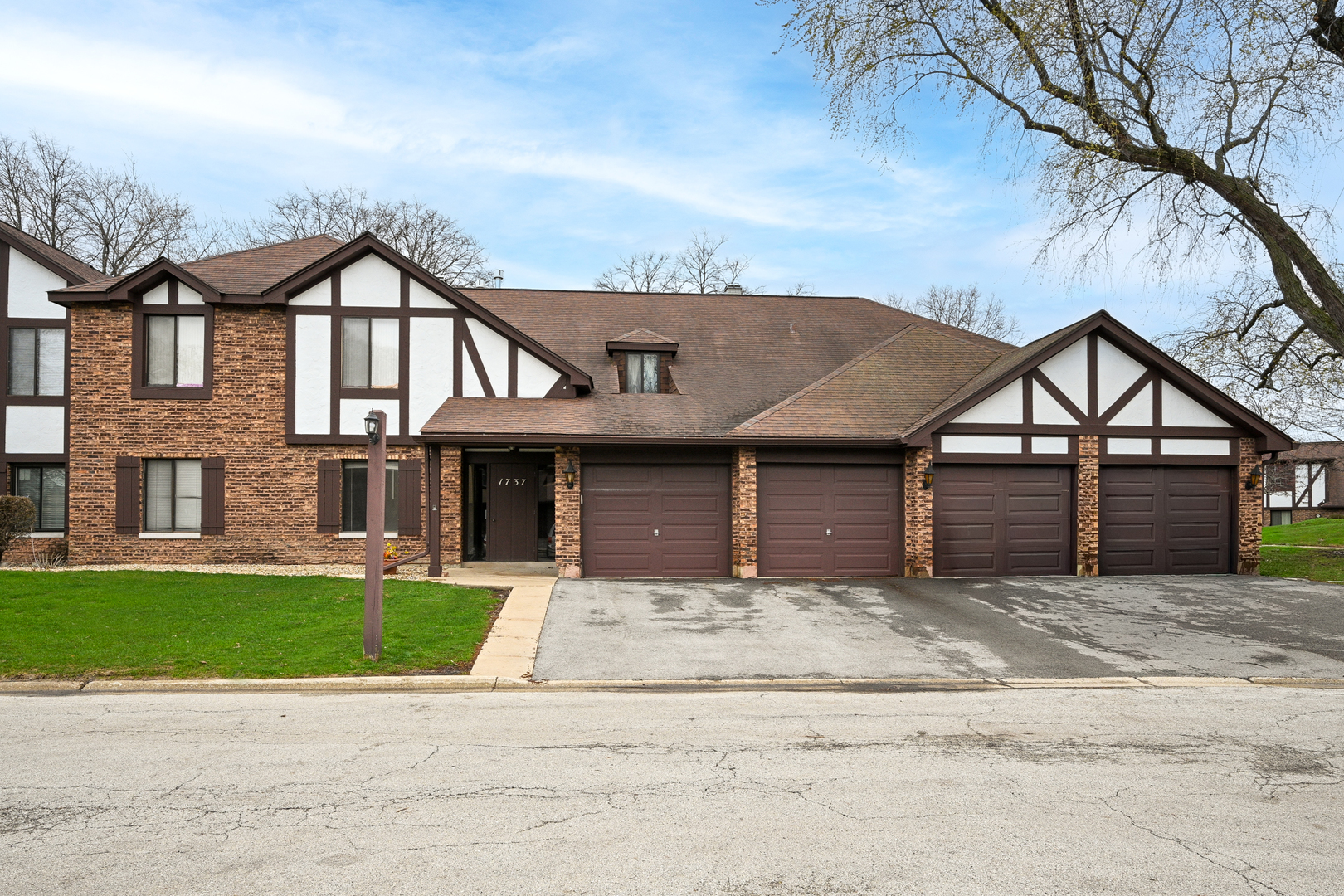 a front view of a house with a garden and entryway